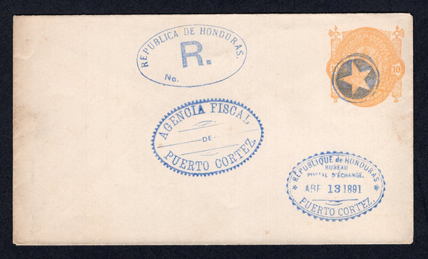 HONDURAS - 1890 - POSTAL STATIONERY: 10c yellow on white 'Seebeck' postal stationery envelope (H&G B2) unused but with negative 'Star' cancel, oval 'REPUBLICA DE HONDURAS R' marking, oval 'AGENCIA FISCAL PUERTO CORTEZ' marking and smaller oval 'REPUBLIQUE DE HONDURAS BUREAU POSTAL D'EXCHANGE ABR 13 1891 PUERTO CORTEZ' marking all in blue. Likely from the official archive for recording the issue with the local Post Offices.  (HON/30249)
