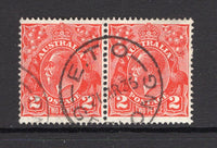 AUSTRALIA - 1931 - CANCELLATION: 2d golden scarlet 'GV Head' issue a fine used pair with superb strike of E.T.O. GEELONG cds of the 'Eastern Telegraph Office' dated 21 MAR 1935. (SG 127)  (AUS/23887)