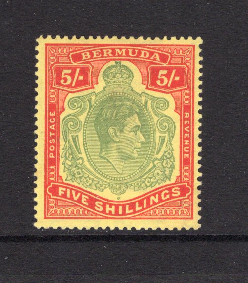 BERMUDA - 1938 - GVI ISSUE: 5/- pea green & carmine on pale yellow 'Substitute' paper GVI 'Key Type' issue, 1948 printing, comb perf 14 x 13¾. A fine mint copy. (SG 118d, Murray Payne #13c)  (BER/24956)