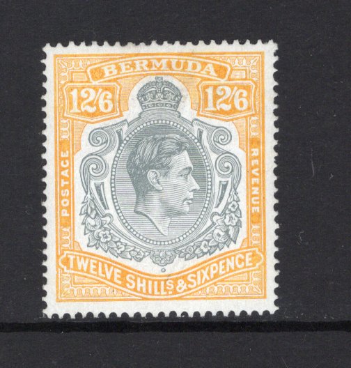 BERMUDA - 1938 - GVI ISSUE: 12/6 grey & pale orange on 'Chalk Surfaced' paper GVI 'Key Type' issue, 1940 printing, comb perf 14. A fine mint copy. 1853 David Brandon certificate accompanies. (SG 120b)  (BER43721)