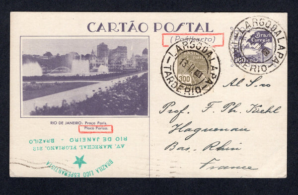 BRAZIL - 1934 - POSTAL STATIONERY: 100r dull violet on grey white 'Exposition' postal stationery view card (H&G 43) with view: 'Rio de Janeiro: Praca Paris' used with added 1920 300rs grey olive 'Industry' issue (SG 394) tied by LARGO DA LAPA TARDE RIO cds's dated 13.II. 1934. Addressed to FRANCE. Commercially used from a member of the Brazilian Esperanto League. A rare card in used condition.  (BRA/29990)