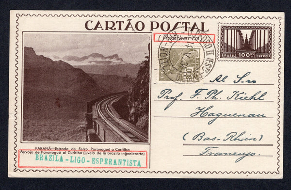 BRAZIL - 1934 - POSTAL STATIONERY: 100r brown 'Exposition' postal stationery view card (H&G 44) with view: 'PARANA - Estrada de Ferro Paranagua a Curitiba' (showing the railway track) used with added 1920 300rs grey olive 'Industry' issue (SG 394) tied by D. PEDRO II (EST) CORREO RIO - NOITE cds dated 14.V. 1934. Addressed to FRANCE. Commercially used from a member of the Brazilian Esperanto League. A rare card in used condition.  (BRA/29991)