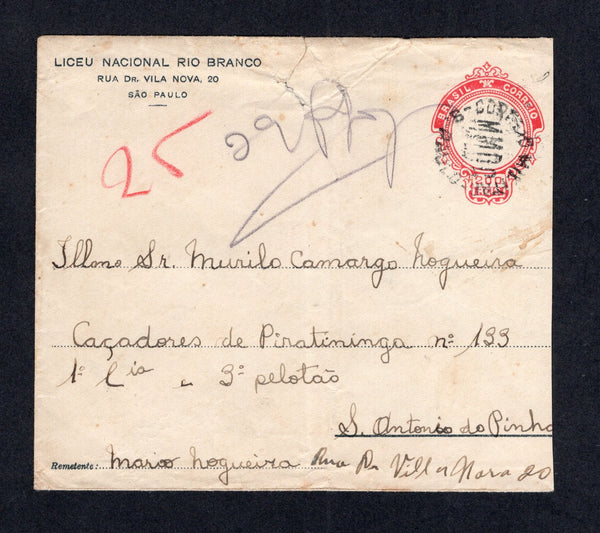 BRAZIL - 1932 - REVOLUTION: Circa 1932. 200rs carmine red on white postal stationery envelope (H&G B29b) with printed 'Liceu Nacional Rio Branco, Rua Dr. Vila Nova, 20, Sao Paulo' return address at top left, sent uncancelled as it was Brazilian national postal stationery and addressed to 'Sr Murilo Camargo Hogueiro, Cacadores de Piratininga No. 133 1o Cia 3o Pelotao, S. Antonio de Pinha' a soldier serving in the MMDC with good strike of undated circular CORREIO MILITAR M.M.D.C. S.PAULO marking in black can