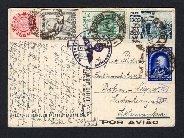 BRAZIL - 1940 - AIRMAIL: 'Boas Festas' LATI Christmas greetings airmail postcard depicting the Lati emblem in white on a blue background franked on message side with 1939 400rs bright ultramarine, 1940 400rs carmine, 400rs grey black, 400rs green and 1200rs blue grey (SG 619, 632 & 636/638) tied by CORREIO AEREO S.PAULO cds's dated 12 XII 1940. Addressed to GERMANY with Nazi censor mark and small LATI numeral markings all on front. A rare card in used condition.  (BRA/43103)