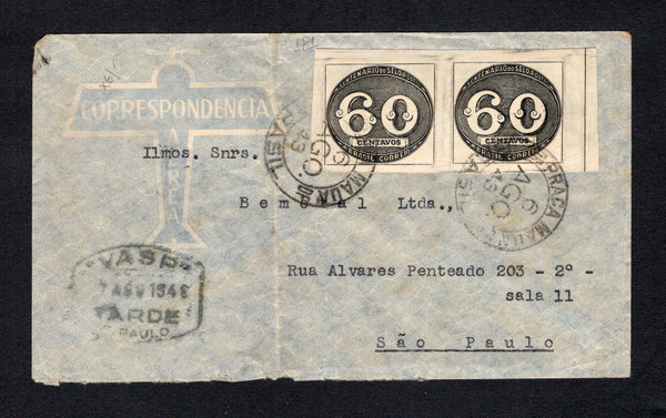 BRAZIL - 1943 - PRIVATE AIRMAIL COMPANIES - VASP: Commercial airmail envelope franked with pair 1943 60rs black 'Bullseye' issue (SG 681) tied by PRACA MAUA cds's (Rio de Janeiro) dated 6 AGO 1943. Addressed to SAO PAULO with large printed black on salmon 'Servicio Postal Rapido VASP' label on reverse and boxed "VASP" 7 AGO 1943 TARDE S.PAULO marking on front. Cover has a few light tones.  (BRA/43104)