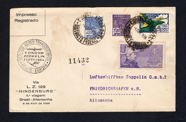 BRAZIL - 1936 - ZEPPELIN: Printed 'Via L.Z. 129 "HINDENBURG" 1a viagem Brasil - Allemanha 5 de Abril de 1936' cover franked with 1920 400rs ultramarine and 700rs reddish violet 'Industry' issue, 1935 1000rs violet and 1933 3500rs blue, green & yellow AIR issue (SG 395, 398, 577 & 530) tied by RIO DE JANEIRO cds's dated 4 ABR 1936. Flown on the First Hindenburg 'Sudamerikafahrt' circular 'Zeppelin' cachet in black on front. Addressed to GERMANY with Friedrichshafen arrival cds on reverse. (Sieger #404)  (BR