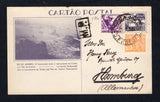 BRAZIL - 1934 - POSTAL STATIONERY: 100r dull violet on grey white 'Exposition' postal stationery view card (H&G 43) with view: 'Rio de Janeiro: O Corcovado (com o monumento de Cristo) e o Pao de Acucar' used with added 1920 100rs orange 'Industry' issue and 1933 200rs violet TAX issue (SG 392 & 541) tied by PRACA MAUA D.FEDERAL cds dated I.IX.1934. Addressed to GERMANY with full commercial message on reverse. A rare card in used condition.  (BRA44383)