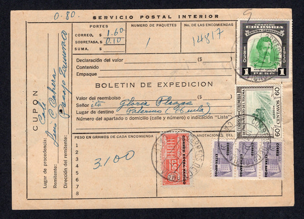 COLOMBIA - 1957 - PARCEL FORM: 'Servicio Postal Interior' BOLETIN DE EXPEDICION parcel post form franked with 1953 1p emerald & black, 1953 50c orange red 'Revenue' issue and strip of three 10c violet all with 'Extra Rapido' overprints and 1956 60c myrtle green & sepia (SG 775, 783, 787 & 889) all tied by CALI cds's dated 10 DIC 1957. Addressed to PALERMO (HUILA) with arrival cds on reverse with 5c TB seal.  (COL/40041)