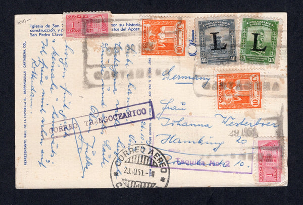 COLOMBIAN AIRMAILS - LANSA - 1951 - POSTCARD: Colour PPC 'Church of San Pedro Claver, Cartagena' franked with 1948 4 x 1c carmine TAX issue (2 on message side & 2 on picture side), 1949 2 x 10c orange 'National' issue (SG 705 & 715) and 1950 30c green and 40c grey with large 'L' overprint (SG 14/15) all tied by the correct CARTAGENA 'Blank' boxed cancel of LANSA dated OCT 29 1951 plus light strike of LANSA TAQUILLLA No.2 marking, boxed 'CORREO TRANSOCEANICO' marking in purple and CORREO AEREO CARTAGENA cds