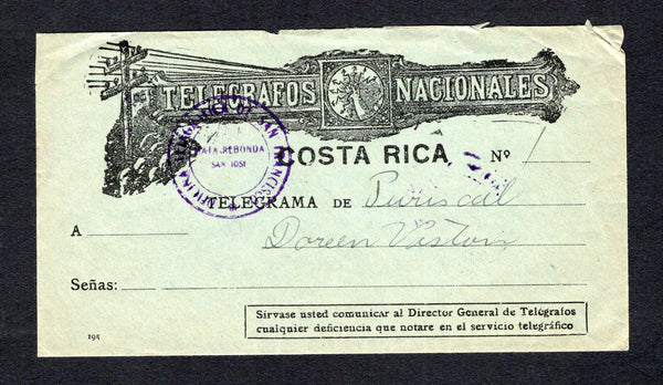 COSTA RICA - 1940 - TELEGRAPH: Circa 1940. Stampless black on blue illustrated 'TELEGRAFOS NACIONALES' envelope showing hand holding lightning bolts with Telegraph poles and lines used with two strikes of undated OFICINA TELEGRAFICA DE SAN FRANCISCO MATA REDONDA SAN JOSE cancel in purple on front & reverse. Addressed to PURISCAL. Fine & unusual.  (COS44335)