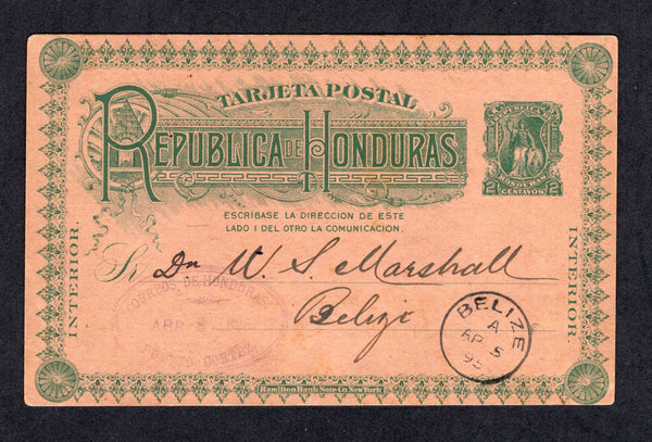 HONDURAS - 1895 - POSTAL STATIONERY & DESTINATION: 2c green on brownish pink 'Seebeck' postal stationery card (H&G 21) used with oval PUERTO CORTEZ cancel in purple. Addressed to BELIZE (British Honduras) with arrival cds on front. Scarce destination.  (HON/9832)