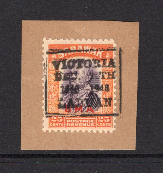 LABUAN - 1946 - SARAWAK USED IN LABUAN: 25c violet & orange issue of Sarawak with 'BMA' overprint used on small piece with good strike of boxed 'VICTORIA DEC 24TH 1846 - 1946 LABUAN' cancel in black. (SG 117)  (LAB/23621)