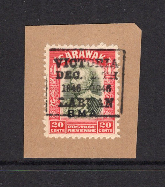 LABUAN - 1946 - SARAWAK USED IN LABUAN: 20c olive green & carmine issue of Sarawak with 'BMA' overprint used on small piece with good strike of boxed 'VICTORIA DEC 24TH 1846 - 1946 LABUAN' cancel in black. (SG 116)  (LAB/23622)