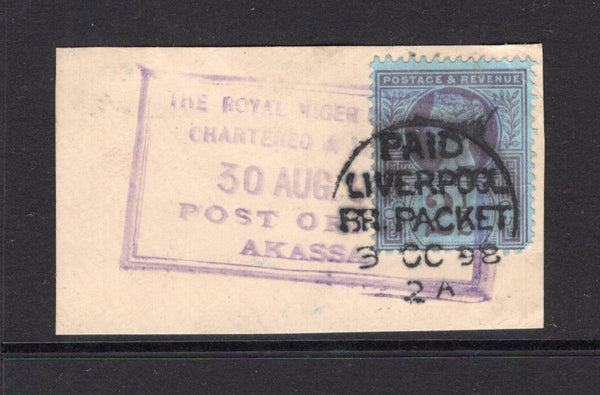 NIGERIA - NIGER COMPANY TERRITORIES - 1898 - GREAT BRITAIN USED IN NIGERIA & CANCELLATION: 2½d purple on blue QV issue of Great Britain used on piece with superb complete strike of large boxed THE ROYAL NIGER COMPANY CHARTERED & LIMITED POST OFFICE AKASSA cancel dated 30 AUG 1898 and also by PAID LIVERPOOL BR PACKET cds dated 9 OCT 1898. Scarce. (SG Z20)  (NIG/24721)