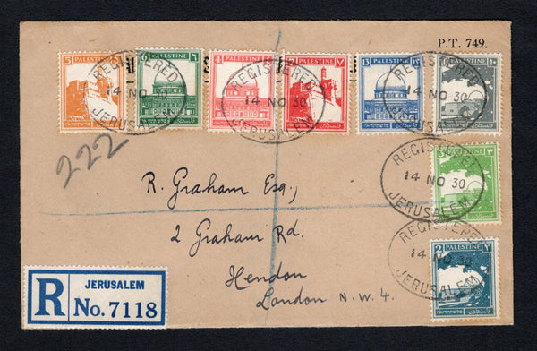 PALESTINE - 1930 - REGISTRATION: Registered cover franked with 1927 2m greenish blue, 3m yellow green, 4m rose pink, 5m orange, 6m deep green, 7m scarlet, 10m slate and 13m ultramarine (SG 90/95 & 97/98) tied by multiple strikes of oval REGISTERED JERUSALEM cancels dated 14 NOV 1930 with printed blue on white 'JERUSALEM' formular registration label alongside. Addressed to UK with large boxed 'POSTS & TELEGRAPHS PALESTINE CASHIER' cachet in purple on reverse.  (PAL/43164)