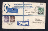 RHODESIA - NORTHERN RHODESIA - 1939 - POSTAL STATIONERY & HIGH VALUE FRANKING: 4d dull blue GVI postal stationery registered envelope (H&G C2) used with added 1938 1d brown, 4d dull violet and a top marginal 2/6 black and green with '223' sheet number handstamp in top margin (SG 27, 36 & 41) all tied by LUANSHYA cds's dated 5 MAY 1939 with printed blue on white 'LUANSHYA' registration label and blue airmail label alongside. Addressed to GERMANY with transit & arrival marks on reverse. The 2/6 is very scarc