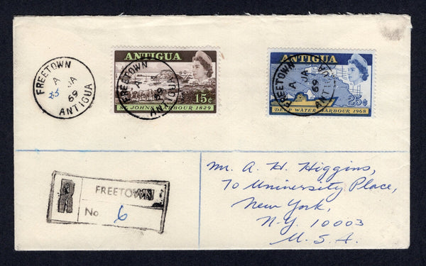 ANTIGUA - 1969 - REGISTRATION & CANCELLATION: Registered cover franked with 1968 15c olive green & blue and 25c olive yellow & blue QE2 issue (SG 222/223) tied by multiple strikes of FREETOWN cds dated 25 JAN 1969 with day added in manuscript and boxed 'FREETOWN' registration marking alongside. Addressed to USA with transit and arrival marks on reverse.  (ANT/40341)