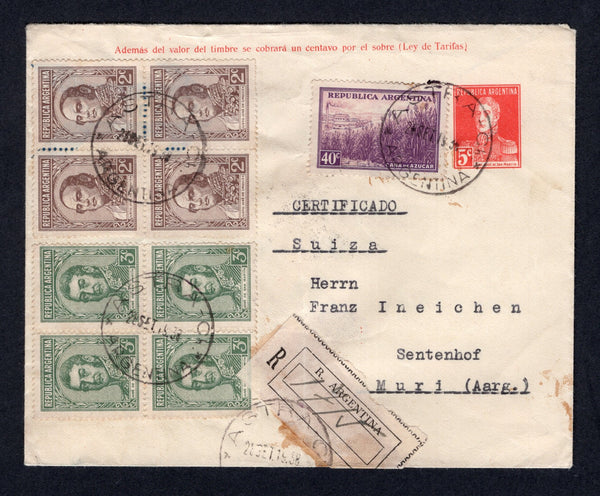 ARGENTINA - 1938 - POSTAL STATIONERY, CANCELLATION & REGISTRATION: 5c red & blue 'San Martin' postal stationery airmail envelope (H&G FB1) used with added 1935 2c brown block of four, 3c green block of four and 1936 40c purple & mauve (SG 646, 647 & 658) tied by multiple strikes of ASTRA - CH (Chubut) cds dated 28 SEP 1938 with plain registration label tied by ASTRA cds alongside. Addressed to SWITZERLAND with arrival cds on reverse. A scarcer origination.  (ARG/40430)