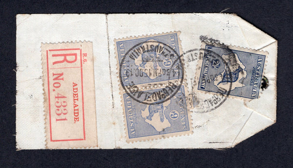 AUSTRALIA  -  1919  -  REGISTRATION & KANGAROO ISSUE: Small linen registered baggage label franked with 1915 2½d indigo (corner damaged) and pair 6d ultramarine 'Roo' issue (SG 36 & 38) tied by REG ADELAIDE cds's with red & white ADELAIDE registration label alongside. Addressed to UK. Couple of creases which do not affect stamps. Very unusual & scarce.  (AUS/101)