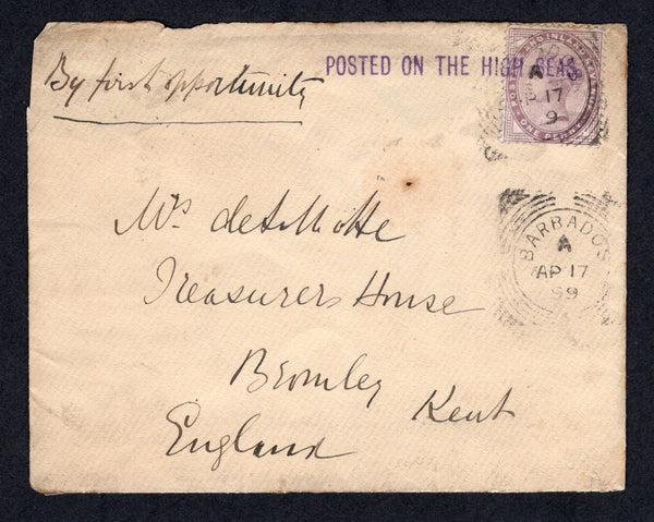 BARBADOS - 1899 - MARITIME & GREAT BRITAIN USED IN BARBADOS: Cover with 'Royal Mail Steam Packet Company' imprint in brown on flap and manuscript 'By First Opportunity' on front franked on front with single 1881 1d lilac QV issue (SG 172) tied by BARBADOS squared circle cds dated AP 17 1899 with second strike alongside and also by straight line 'POSTED ON THE HIGH SEAS' marking in purple. Addressed to UK. This cover was carried by the R.M.S. Trent. Cover a little worn in places and with some faults on the 