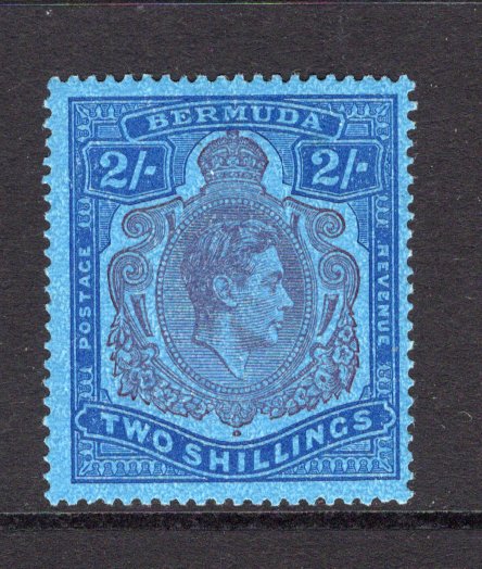 BERMUDA - 1938 - GVI ISSUE: 2/- purple & deep blue on mottled blue 'Substitute' paper GVI 'Key Type' issue, 1941 printing, comb perf 14 x 13¾. A fine mint copy. (SG 116c, Murray Payne #11a)  (BER/11236)