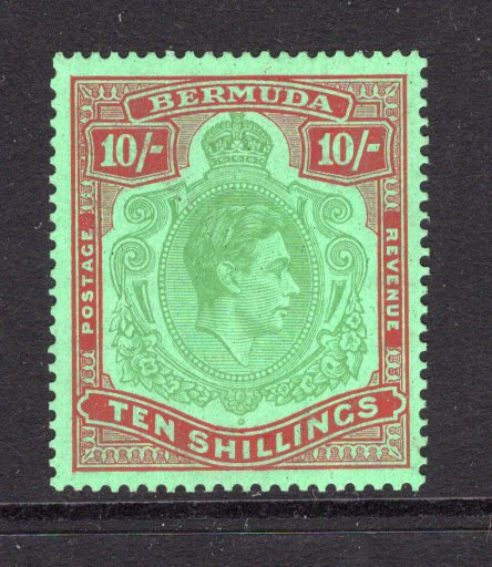 BERMUDA - 1938 - GVI ISSUE: 10/- yellow green & deep red on green 'Substitute' paper GVI 'Key Type' issue, 1943 printing, comb perf 14 x 13¾. A fine mint copy. (SG 119c, Murray Payne #14b)  (BER/11248)