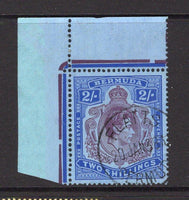 BERMUDA - 1938 - GVI ISSUE & CANCELLATION: 2/- deep purple & ultramarine on grey blue 'Chalk Surfaced' paper GVI 'Key Type' issue, 1938 printing, comb perf 14 x 13¾. A fine corner marginal copy used with good strike of FLATTS cds dated 20 JAN 1938, first day of issue. Very scarce as such. (SG 116, Murray Payne #11)  (BER/27264)
