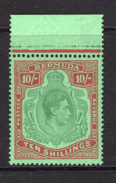 BERMUDA - 1938 - GVI ISSUE: 10/- green & red on green 'Substitute' paper GVI 'Key Type' issue with emerald back, 1946 printing, comb perf 14 x 13¾. A fine mint top marginal copy. (SG 119d, Murray Payne #14c)  (BER/27266)