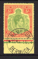 BERMUDA - 1938 - GVI ISSUE: 5/- pea green & carmine on pale yellow 'Substitute' paper GVI 'Key Type' issue, 1949 printing. comb perf 13¼ x 13. A fine used copy on piece tied by lovely HAMILTON cds dated 15 MAY 1950. (SG 118f, Murray Payne #23)  (BER/28860)