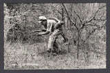 BOLIVIA - 1933 - CHACO WAR: Real photographic black & white PPC of soldier stealthily moving through the bush inscribed 'GUERRA DEL CHACO Huellando' on picture side and 'Editor y Fotografo LUIS BAZOBERRI G. Casilla 11 Cochabamba (Bolivia) Prohibida la reproduccion' on message side. Fine unused & very scarce.  (BOL/38936)