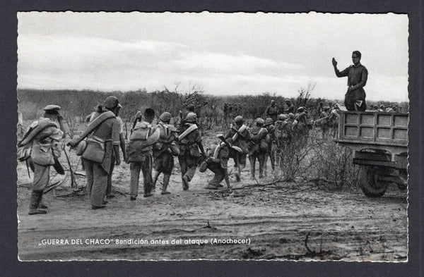 BOLIVIA - 1933 - CHACO WAR: Real photographic black & white PPC of soldiers being blessed by chaplain as they go out to battle inscribed 'GUERRA DEL CHACO Benedicion antes del ataque (Anochecer)' on picture side and 'Editor y Fotografo LUIS BAZOBERRI G. Casilla 11 Cochabamba (Bolivia) Prohibida la reproduccion' on message side. Fine unused & very scarce.  (BOL/38941)