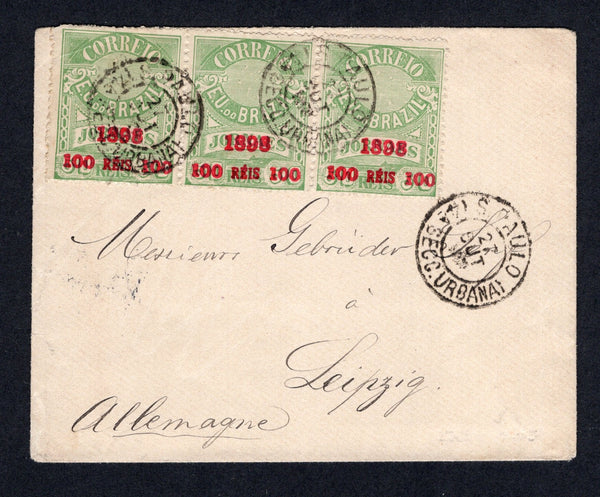 BRAZIL - 1898 - PROVISIONAL ISSUE: Cover franked with strip of three 1898 100rs on 50rs yellow green 'Newspaper' SURCHARGE issue (SG 188) tied by S.PAULO (4a SECC. URBANA) cds. Addressed to GERMANY. A fine franking.  (BRA/26548)