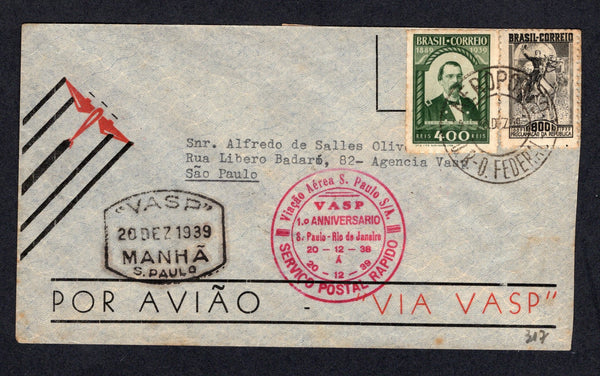 BRAZIL - 1939 - PRIVATE AIRMAIL COMPANIES - VASP: Airmail cover franked with 1939 400rs green & 800rs black (SG 624/625) tied by AEROPORTO D. FEDERAL cds dated 20 DEC 1939. Addressed to SAO PAULO with boxed "VASP" 20 DEZ 1939 MANHA S.PAULO marking and circular 'Vivacao Aerea S. Paulo S/A VASP 1o ANNIVERSARIO S. PAULO - RIO DE JANEIRO 20-12-39 20-12-39 SERVICIO AEREO RAPIDO' commemorative cachet in red. Cover has a large pink 'Servicio Postal Rapido VASP ESTAFETA 9' label on reverse with SAO PAULO arrival cd