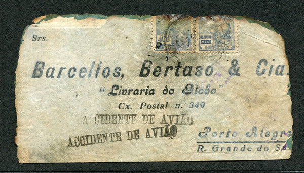 BRAZIL - 1938 - CRASH MAIL: Badly damaged & burned airmail cover from RECIFE to PORTO ALEGRE flown on the Condor Junkers JU52 aeroplane 'Guarany' which crashed near SANTOS on 22nd May while flying the Rio de Janeiro - Porto Alegre route. The cover has two strikes of the straight line 'ACCIDENTE DE AVIAO' handstamp in purple. Scarce.  (BRA/26608)