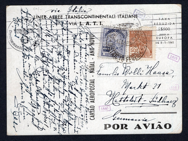 BRAZIL - 1940 - AIRMAIL: Boas Festas' LATI Christmas greetings airmail postcard depicting the Lati emblem in white on a blue background franked with 1920 500rs brown & 2000rs violet 'Industry' definitive issue (SG 407 & 411) tied by CORREIO AEREO DISTRITO FEDERAL (Rio de Janeiro) cds dated 13 DEC 1940. Addressed to GERMANY with Nazi censor mark and small LATI numeral markings all on front. A rare card in used condition.  (BRA/38518)