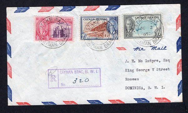 CAYMAN ISLANDS - 1953 - REGISTRATION, CANCELLATION & DESTINATION: Registered airmail cover franked with 1950 2d reddish violet & rose carmine, 2½d turquoise & black and 6d red brown & blue GVI issue (SG 139/140 & 142) tied by three fine strikes of STAKE BAY cds dated OCT 2 1950 with boxed 'CAYMAN BRAC' registration marking in purple alongside. Addressed to DOMINICA with JAMAICA, ANTIGUA and BARBADOS transit cds's on reverse. A fantastic routing via three different Islands.  (CAY/40092)