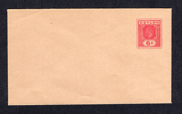 CEYLON - 1915 - POSTAL STATIONERY: 6c dark carmine GV postal stationery envelope on smooth buff paper with rough inside and 'GOVERNMENT PRESS CEYLON imprint under flap (H&G B52), a fine unused example.  (CEY/40375)