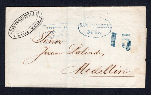 COLOMBIA - Circa 1850 - PRESTAMP: Cover from SANTA MARTA to MEDELLIN with firms cachet in black at top left and fine strike of oval SANTAMARTA DEBE marking in blue with '15' rate marking alongside also in blue and further handstamped on arrival with boxed 'RECIBIDA EN MEDELLIN EN 18 DE MARZO 1856' marking in blue. A nice cover.  (COL/27866)