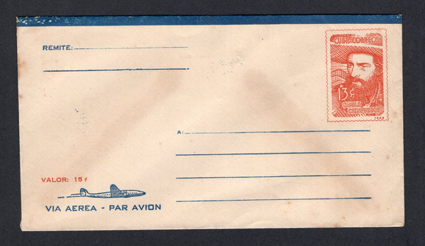 CUBA - 1965 - POSTAL STATIONERY: 13c red 'Francisco Cienfuegos' airmail postal stationery envelope with 'VALOR 15c' overprint in red. A good unused copy. Uncommon.  (CUB/17520)