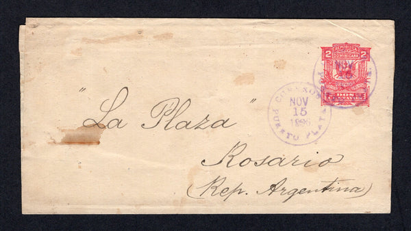 DOMINICAN REPUBLIC - 1893 - POSTAL STATIONERY: 2c pink on cream postal stationery wrapper (H&G E3) used with two strikes of PUERTO PLATA cds dated NOV 15 1896. Addressed to ROSARIO, ARGENTINA. Couple of small stains on front.  (DOM/40846)