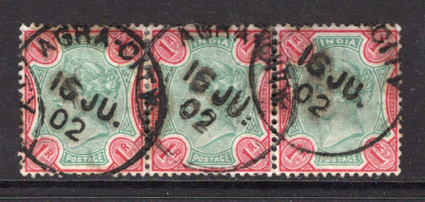 INDIA - 1892 - MULTIPLE: 1r green & aniline carmine QV issue, a superb used strip of three with three strikes of AGRA-CITY cds dated 16 JUN 1902. (SG 106)  (IND/12626)