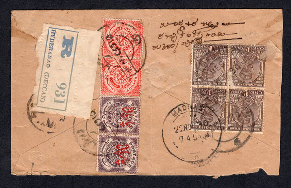 INDIAN STATES - HYDERABAD - 1930 - COMBINATION MAIL & REGISTRATION: Registered cover franked on reverse with Hyderabad 1915 pair 1a scarlet and 1930 pair 4p on ¼a brown purple (SG 36b & 39) tied by native script HYDERABAD cds's plus 1922 block of four 1a chocolate GV 'National' issue (SG 197) tied by HYDERABAD DECCAN REG cds's (English wording) with printed blue on white HYDERABAD (DECCAN) registration label alongside. Addressed to MADRAS with arrival cds on reverse. Cover has a few peripheral faults but s