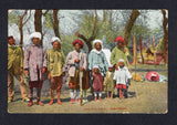 INDIA - 1930 - POSTCARD & KASHMIR: Circa 1930. Coloured PPC 'Shooting Party - Kashmere' showing group of men and children with guns. Unused.  (IND/611)