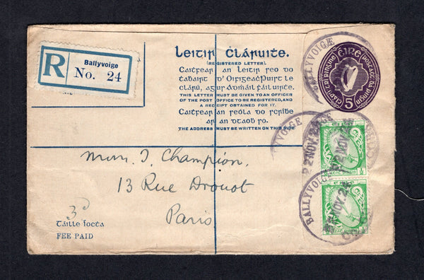 IRELAND - 1924 - POSTAL STATIONERY & REGISTRATION: 5d purple 'Harp' postal stationery registered envelope (FAI #EU 2b G, H&G C5a) used with added pair 1922 ½d bright green (SG 71) tied by multiple strikes of BALLYVOIGE CO. CORK temporary rubber 'Skeleton' cancel dated 22 NOV 1924 with printed blue on white 'Ballyvoige' registration label alongside. Addressed to FRANCE. Fine and scarce.  (IRE/34394)