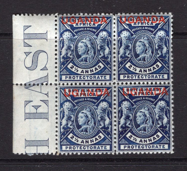 KENYA, UGANDA & TANGANYIKA - 1902 - UGANDA - MULTIPLE: 2½a deep blue QV issue with 'UGANDA' overprint in red, a fine mint side marginal block of four with part 'BRITISH EAST AFRICA' imprint in margin. (SG 93)  (KUT/14059)