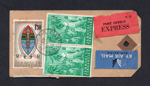 KENYA, UGANDA & TANGANYIKA - 1965 - BAGGAGE LABEL, EXPRESS &  REGISTRATION: Registered baggage label franked on reverse with 1962 pair 30c emerald and 1s 30c multicoloured (SG 120 & 122) tied by DAR-ES-SALAAM TANGANYIKA cds dated 5 JAN 1965 with airmail label and printed black on red 'POST OFFICE EXPRESS' label alongside plus printed blue on white 'Dar-es-Salaam No."C" Tanganyika' registration label on reverse. Addressed to NAIROBI. Some creasing.  (KUT/40689)