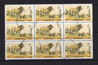 KENYA, UGANDA & TANGANYIKA - 1980 - TANZANIA - OFFICIAL ISSUE & MULTIPLE: 5/- 'Lion' issue with 'OFFICIAL' opt reading up from the 'John Waddington' printing. A fine cds used block of nine. Block has some very light creasing. (SG O69)  (KUT/40697)