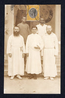 KENYA, UGANDA & TANGANYIKA - 1929 - TANGANYIKA - CANCELLATION & POSTCARD: Unaddressed real photographic sepia PPC showing group of priests on some steps franked on picture side with 1927 10c black & yellow GV issue (SG 94) tied by two strikes of CAMP POST OFFICE DARESSALAAM cds dated AU 24 1929 with additional strike on reverse along with manuscript notation with the names of the priests shown in the photo. The Camp P.O. was located in the K.A.R. Depot and only operated between 1924 - 1939. An unusual item