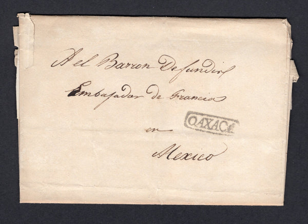 MEXICO - 1834 - PRESTAMP: Complete folded letter written in French datelined 'Oajaca le 1 Avril 1834' with good strike of small boxed OAXACA marking in black on front. Addressed to 'Del Barron Defundier, Embajador de Francia en Mexico'. Cover a little worn in places.  (MEX/39137)