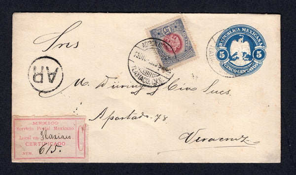 MEXICO - 1900 - REGISTRATION & AR: 5c blue postal stationery envelope (UPSS #E61, H&G B51) used with added 1899 15c purple & lavender (SG 271) tied by TLAXIACO cds's dated 23 DIC 1900 with circular 'AR' marking alongside and fine printed red on white registration label with 'Tlaxiaco' added in manuscript. Addressed to VERACRUZ with arrival cds on reverse. Very attractive.  (MEX/40438)